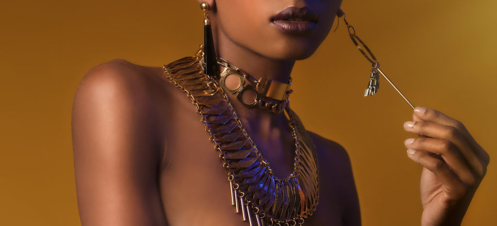 A close-up of a woman covered in accessories from designer Laruicci.
