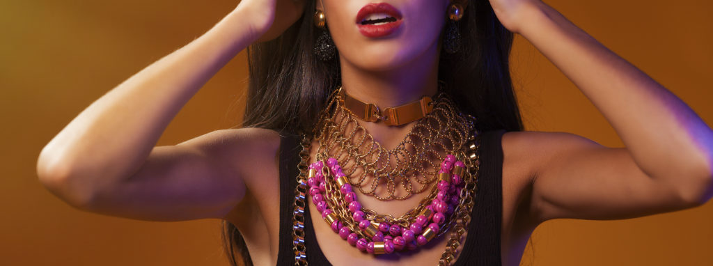 A portrait of a woman covered in accessories from designer Laruicci.